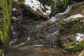 Small creek near Zlata Koruna village with green moss stone in winter cold day Royalty Free Stock Photo