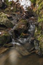 Small creek near Zlata Koruna village with green moss stone in winter cold day Royalty Free Stock Photo