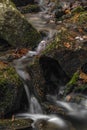 Small creek near Zlata Koruna village with green moss stone in winter cold day Royalty Free Stock Photo