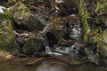 Small creek near Zlata Koruna village with green moss stone in winter cold day Royalty Free Stock Photo