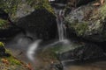 Small creek near Zlata Koruna village with green moss stone in winter cold day Royalty Free Stock Photo