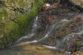 Small creek near Zlata Koruna village with green moss stone in winter cold day Royalty Free Stock Photo