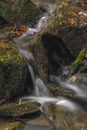 Small creek near Zlata Koruna village with green moss stone in winter cold day Royalty Free Stock Photo