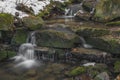 Small creek near Zlata Koruna village with green moss stone in winter cold day Royalty Free Stock Photo