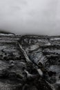 Small Crevice Runs Along Dirty Glacier