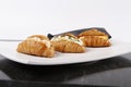 Small croissants filled with cream cheese, salmon and eggs