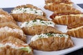 Small croissants filled with cream cheese, salmon and eggs