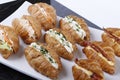 Small croissants filled with cream cheese, salmon and eggs