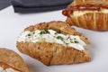 Small croissants filled with cream cheese, salmon and eggs