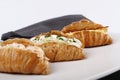 Small croissants filled with cream cheese, salmon and eggs