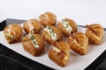 Small croissants filled with cream cheese, salmon and eggs