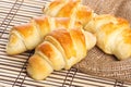 Small croissants on wooden table Royalty Free Stock Photo