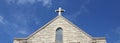 Cross on Church Steeple of Old Christian Stone Temple Royalty Free Stock Photo