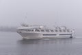 Small cruise ship Grande Mariner outbound in fog Royalty Free Stock Photo