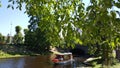 Small cruise ship sailing through the pilsetas kanals Royalty Free Stock Photo