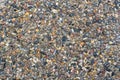 Small crushed multicolored road stones of different shapes and sizes. Gravel texture and natural background for design Royalty Free Stock Photo