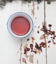 A small cup of Rosehip Tisane with loose leaves by the side Royalty Free Stock Photo