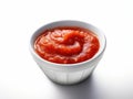 Small cup of tomato sauce on a white surface Royalty Free Stock Photo