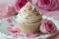 small cupcake surrounded by pink roses and white frosting Royalty Free Stock Photo