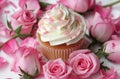 small cupcake surrounded by pink roses and white frosting Royalty Free Stock Photo