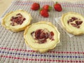 Small curd cheese cakes with strawberry jam