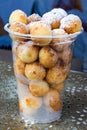 Small curd donuts in a plastic container