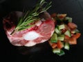 Small cut of raw oxtail with fresh chopped vegetables Royalty Free Stock Photo