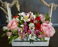 Flowers cute bouquet with roses and alstroemerias pink white green, wooden box