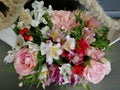 Flowers cute bouquet with roses and alstroemerias pink white green, wooden box