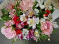 Flowers cute bouquet with roses and alstroemerias pink white green, wooden box