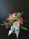 Flowers cute bouquet with roses and alstroemerias pink white green, wooden box