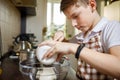 Small cute boy cooking dessert on the kitchen