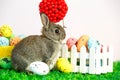 Small cute bunny with easter eggs