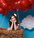 Small cute girl flying on red heart balloons Valentines day Royalty Free Stock Photo