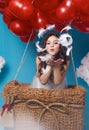 Small cute girl flying on red heart balloons Valentines day Royalty Free Stock Photo