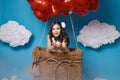 Small cute girl flying on red heart balloons Valentines day Royalty Free Stock Photo