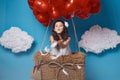 Small cute girl flying on red heart balloons Valentines day Royalty Free Stock Photo