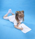 Small cute girl is sketching