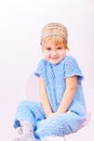 Small cute kid in knitted blue dress