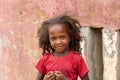 Small cute Malagasy girl with long hair , little dancer on celebration in village Bekopaka, region Melaky, Madagascar