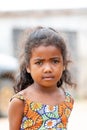 Small cute Malagasy girl with long hair , little dancer on celebration in village Bekopaka, region Melaky, Madagascar.