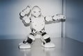 Small cyborg robots, humanoids with face and body dances to music