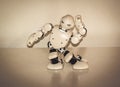 Small cyborg robots, humanoids with face and body dances to music Royalty Free Stock Photo