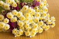 Small Daisies on a Wooden Table