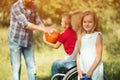 Small daugher of a disabled woman is smiling at camera Royalty Free Stock Photo