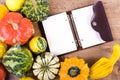 Small decor pumpkins on wooden background. Autumn frame Royalty Free Stock Photo