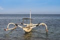 Small decorated boat tied with rope in a seashore with peaceful exotic weather Royalty Free Stock Photo