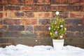 Small decorated christmas tree abandoned