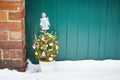 Small decorated christmas tree abandoned