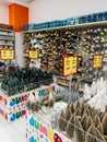 Podgorica, Montenegro - 25 december 2022: Small decorated Christmas trees are on the shelves in the supermarket